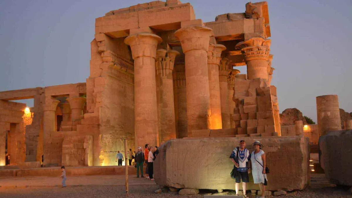 The floodlit columns of Kom Ombo temple at dusk on a luxury Egypt tour Nile cruise, Kom Ombo, Egypt