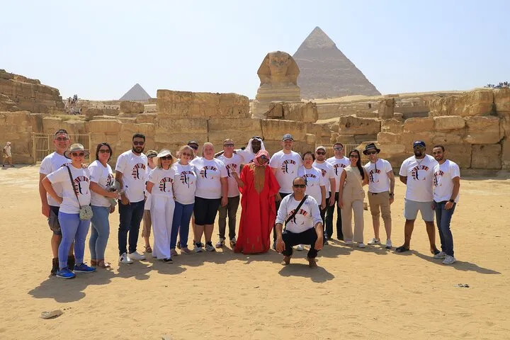 Travelers at the Great Sphinx with the Pyramid of Khafre behind on a 9-day luxury Egypt tour, Giza, Egypt