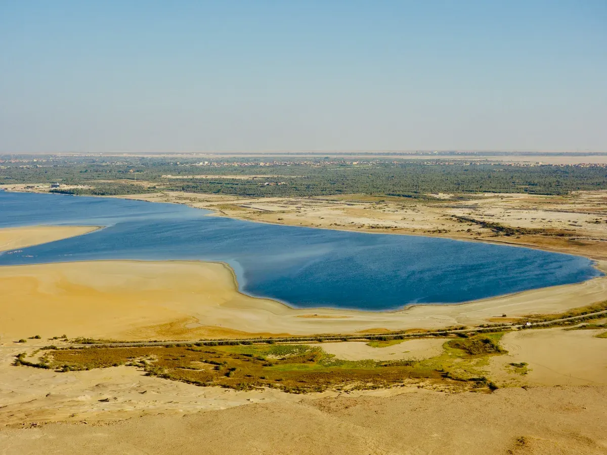 Lake Qarun and the surrounding desert seen from above on a luxury Egypt tour, Fayoum, Egypt